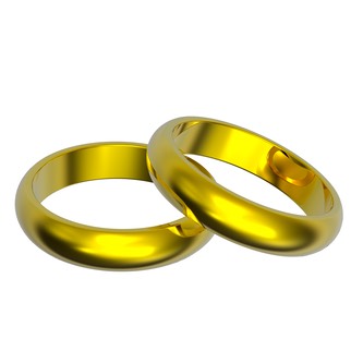 Two gold wedding rings isolated on white.